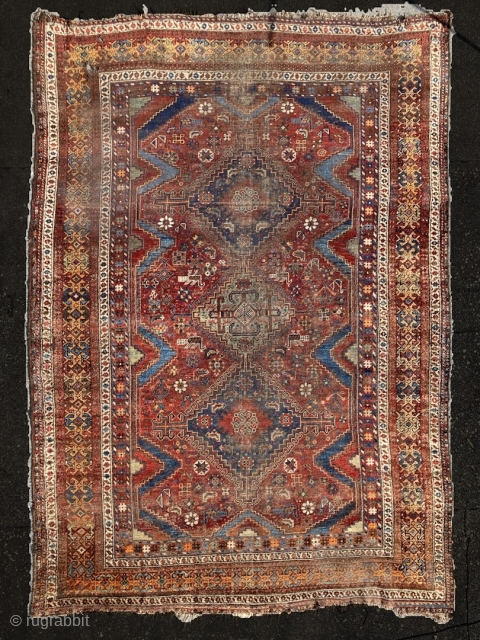 Richly coloured Shiraz/ Khamseh (?), 1900-1920, 217x300 cm (7"1' x 9",10').

Large herd of animals, shiny colors, worn rug.               