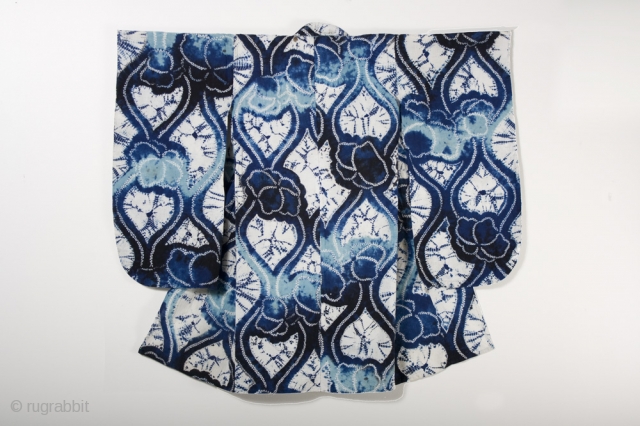 This is a wonderful Japanese children's yukata, or cotton kimono, with a bold
shibori dyed pattern of undulating lines and flowers. This dyed
pattern was created using multiple techniques, including ori-nui
(folded and stitched) and  ...