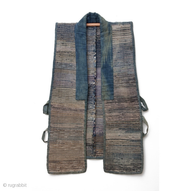 A well-worn cotton sodenashi, or work vest. It's weft is woven using shreds of fabric salvaged from other garments or cloth, with a cotton warp. Colors shift gracefully from faded neutrals to  ...