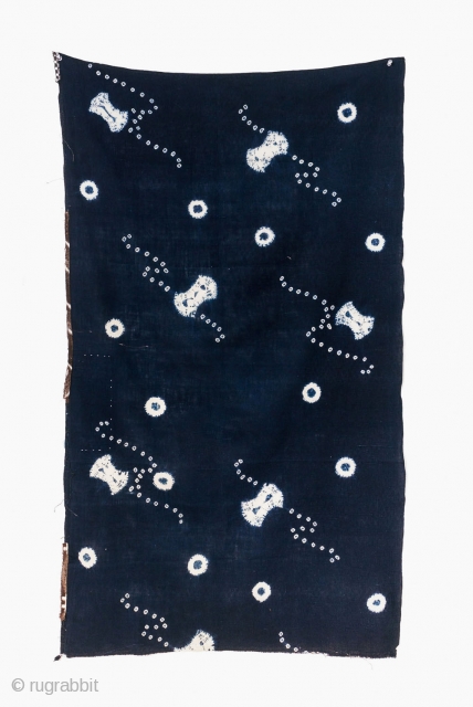 This is a vintage Japanese cotton textile fragment decorated with mixed shibori tie-dye techniques of kanoko (spaced dots), boshi (capped circles), and shapes, perhaps of fundo weights. The pattern is relaxed and  ...