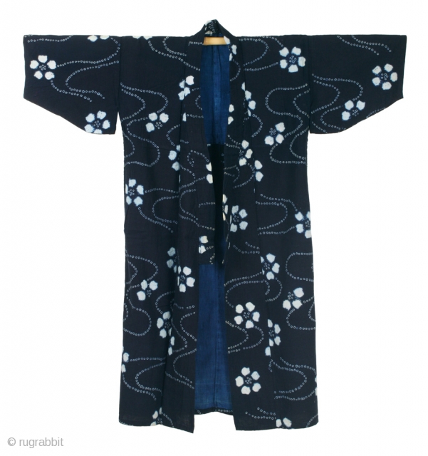 This is a stunning and beautifully constructed long shibori work coat, or nagagi, from the Tohoku region of Japan. 


This particular shibori style - crystal whites against deep botanical indigo - is  ...