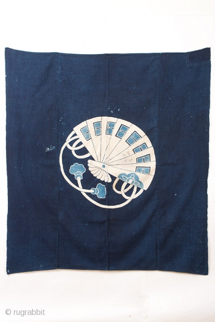 This is a vintage Japanese indigo dyed furoshiki, or wrapping cloth. The cloth is comprised of four 14" panels of fabric which have been stitched together and decorated with a tsutsugaki rice  ...