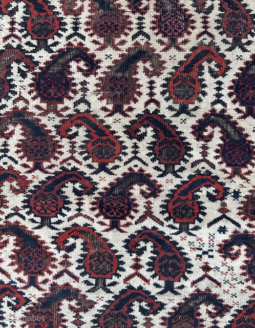White ground boteh Baluch rug.19th century. Low pile in places with bottom kilim end missing. Lovely soft wool and good age. Email owenrugs@gmail.com          