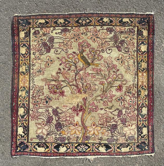 Antique Kirman poshti rug. 19th century. 72x72cm. Decorated with birds and vines. Email enquiries to owenrugs@gmail.com