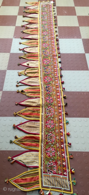 Rabari Mochi hand embroidered   long Toran  from bhujodi village Kutch region Gujarat with very fine work with vegetables dyes the size of the Toran is 112 inch X 18  ...