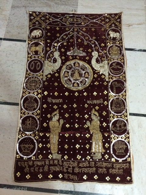 Jain temple hanging with used treated gold and silver tread and foil work on velvet with dates on it according to Hindu calendar from mount Abu in Rajasthan     