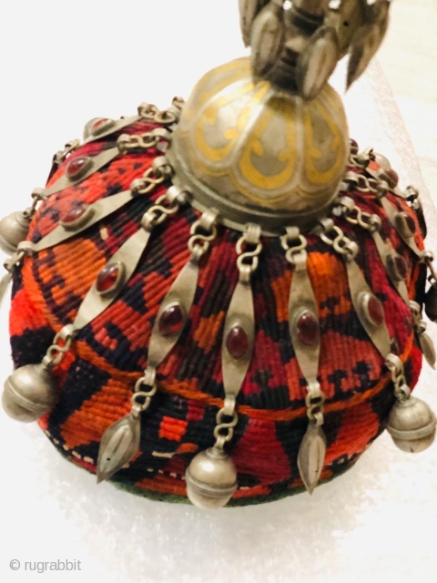 Vintage child's hat from Turkmenistan, Central Asia circa 1925 adorned with low grade silver ornaments studded with glass (resembling agate). The hat is in good condition without any damages or holes and  ...