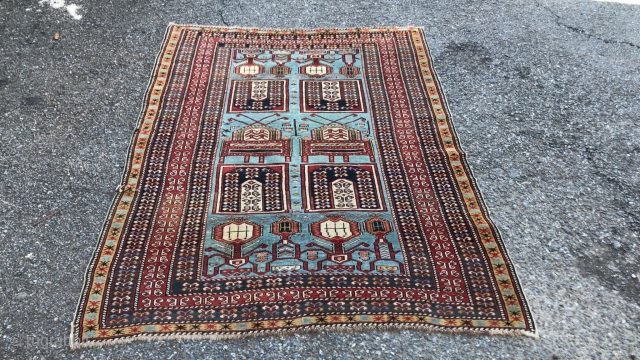  This is an antique Tachte Shirvan rug woven during the last quarter of the 19th century circa 1880. It has a rare powder blue background color with an even more rare  ...