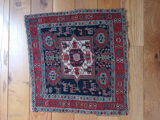 Shahsavan 21"x 22" Silk wefted and has some light bule silk highlights in the small corner medallions                