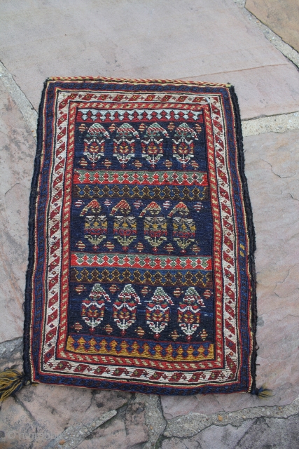 A top Qashqai spindle bag made using a flat-weave technique and all natural dyes. It measures 1.1 x1.7 Ft

The front is made up of repeating row of the famous boteh motif made  ...