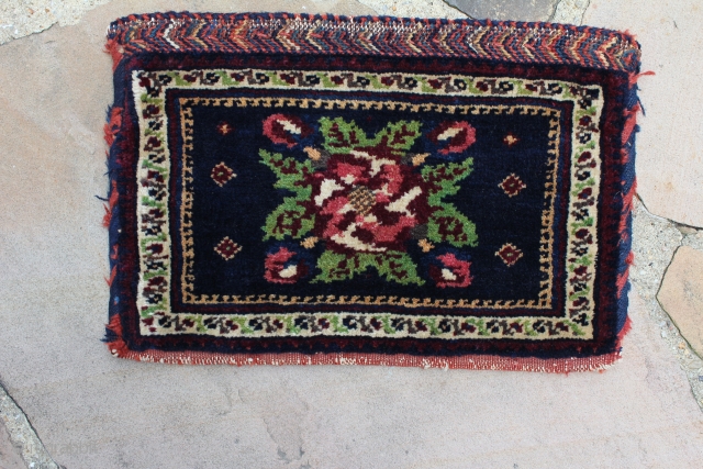 This is an antique Afshar chanteh circa 1900 and measures 1'.2"x 10".  Its in full pile condition and has its original kilim back. It has a golfarang design set on a  ...