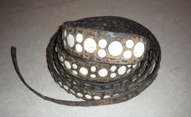 this is a rare old leather belt with conch inlay made by the lisu people of southwest china near the myangmar border and was worn by some men of this group. the  ...