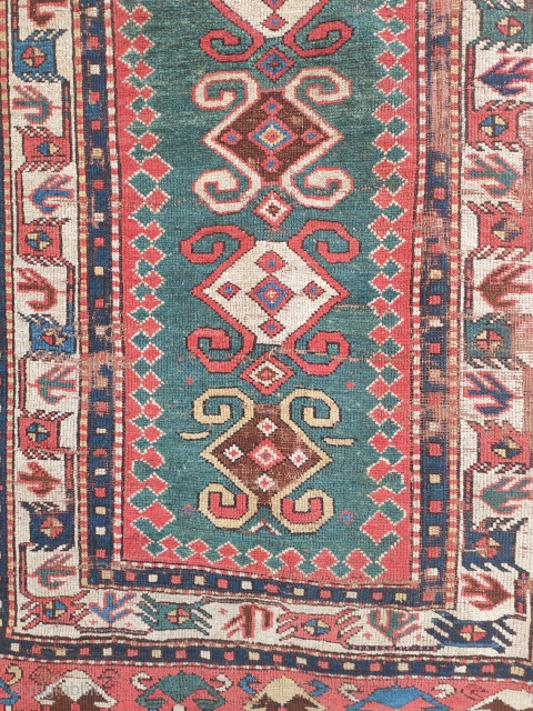 early tribal kazak with white ground bird-borders and great colours. 2 main areas of wear, on the right side and at the top of the narrow green field. no restorations apart of  ...