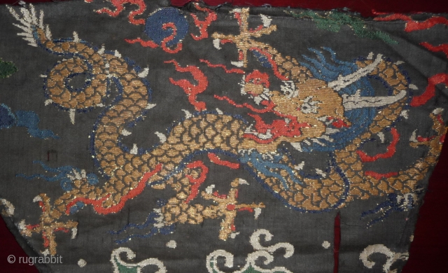 early 18th century silk brocade fragment with gilded paper threads. probably lower part of a dragon robe. china.               