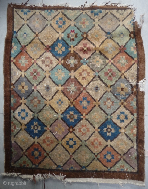 interesting small rug from the inner mogolia, most probably from the chifeng area. the colours are not all natural, there is some fuchsine. some loss to the natural undyed brown border. china,  ...