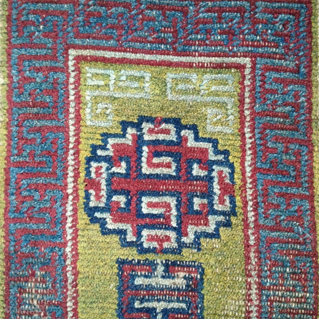 early tibetan saddle rug with beautiful clear old colors. exquisite light green back ground. very fine weave and super soft handle.. mid 19th century         