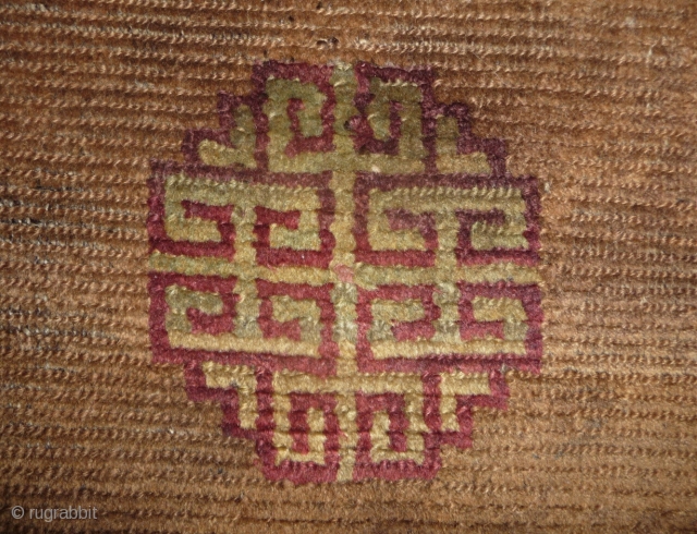 beautiful early tibetan monastic bench cover fragment with floating guls on an empty brown space. lovely patinated old colors, the black color in places is a natural brown overdyed with dark indigo.super  ...