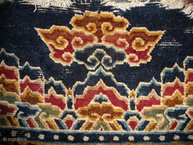 fragment of a rare tibetan saddle rug. it is late 19th century but all colors are natural. the main color is a wonderfull gold yellow. uncommon is its small size, trapezoidal shape  ...