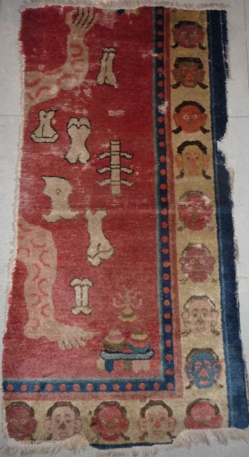 fragment of a very rare tantric rug depicting the tibetan sky burial. baotou/zuoqi area for the tibetan market.               