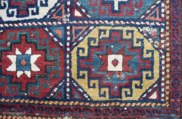 mid 19th c shasavan long rug with rare border and well deep saturated colors, beautiful greens, strong yellow and orange... some camel pile, missing a bit all around and scattered old repiling.  ...