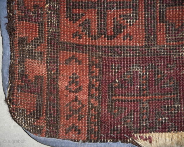 one of the rare baluch pieces found in tibet.a prayer rug with a simple design made with 2  natural dyed and 2 undyed colors, but not without its protectiv amulets. nice  ...