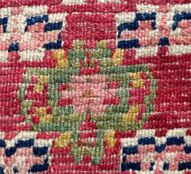 nice tibetan mat around 1900 with nice all natural colors including the light pink; beautiful gold yellow and green..uncommon center drawing and design element right and left... superb condition with high pile  ...