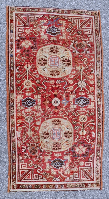 Early small Khotan rug (34" x 65"). Circa 1800. Good condition. Overcast sides. Not normally seen in this size. Please email me directly:  patrickpouler@gmail.com.        