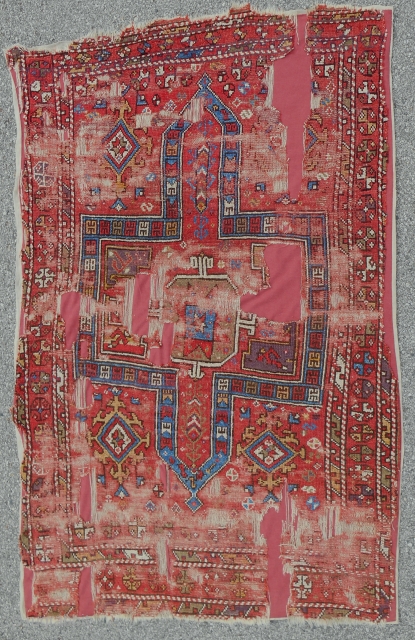 Circa 1700 Central Anatolian rug. 4'-9" x 7'-6". Mounted on linen.                      