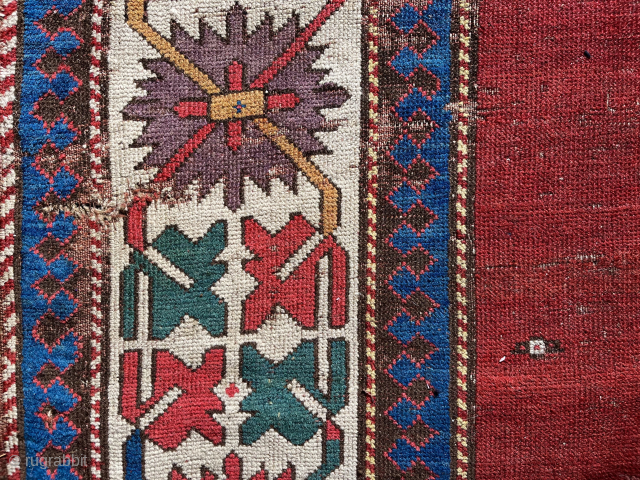 Early Kazak red field complete rug. Circa 1820 (detail) About 4 x 9 ft. Clean. Decent condition for age. Much better than most. Please email: patrickpouler@gmail.com.       