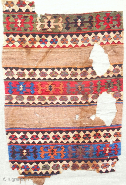 Early 19th c. Central Anatolian banded kilim fragment with real camel. Conserved and mounted expertly on linen.                