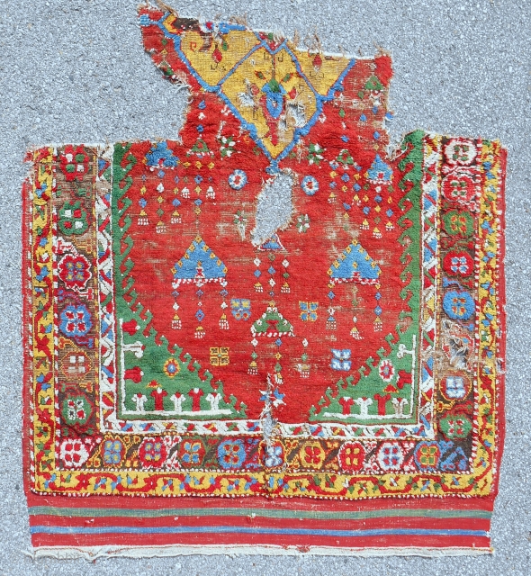 Late 18th c. Anatolian Dazkiri rug fragment. Areas of good pile. Original sides and end kilim. Crazy color! No repairs.             