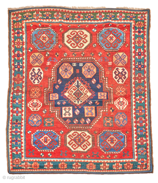 Circa 1850-70 Caucasian Karopchov Kazak rug. Small. 3'-10" x 4'- 11". Very good condition. Rare design with heraldic medallion and stunning green ground main border. Please email: patrickpouler@gmail.com