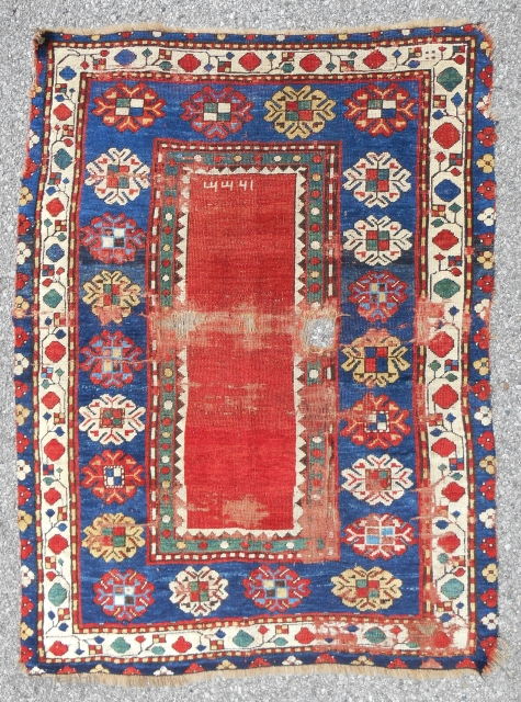 Small Lambalo Kazak rug dated very early. Probably mid 19th c. Decent condition with mostly good, sexy pile. Clear, saturated color. Clean.           