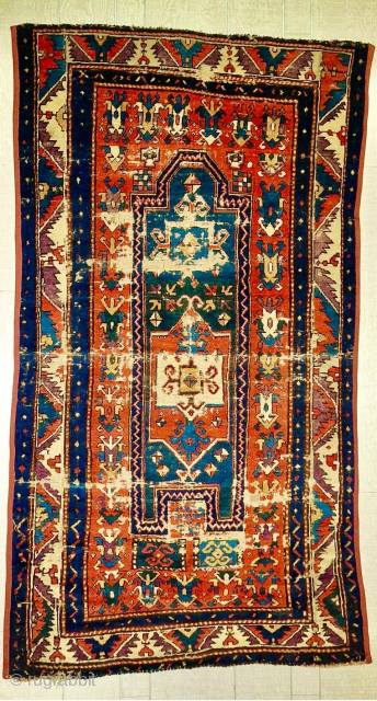 Early Kazak Fachralo prayer rug. Circa 1850. Extraordinary shimmering color. Good pile with some moth damage. Just professionally washed. Pristine! Email: patrickpouler@gmail.com