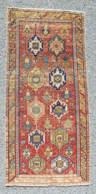 Circa 1800, small (only 32"x 68"), distinctive “linked palmette” classical Caucasian rug with some old faded repair. Just cleaned. Cool and rare!           