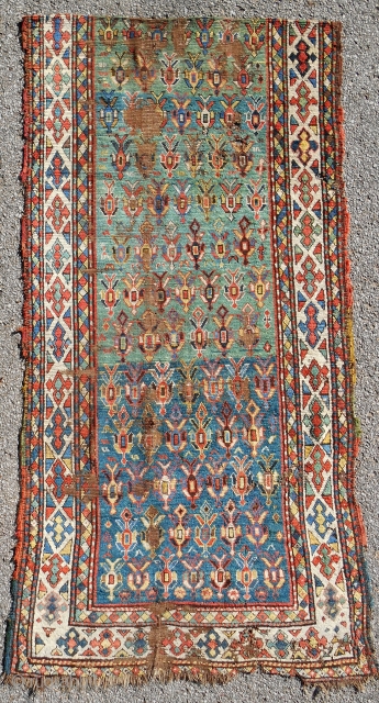 Extremely rare green ground Kazak rug fragment with outstanding border. Mid 19th c. or older.                  