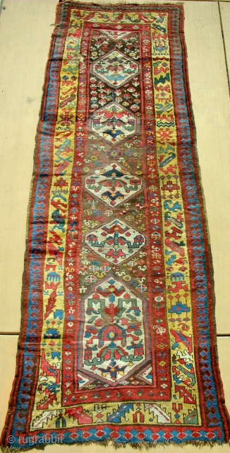 Circa 1870 Persian Kurdish long rug with a bold and very playful design. Nearly full silky pile with clear saturated color.            