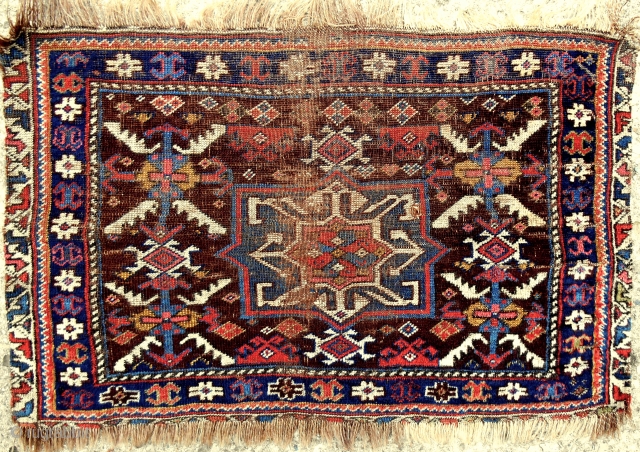 Early North Azerbaijan bagface. Fine and thin like a cloth. Rare aubergine field color. See Rothberg’s great new book, Nomadic Visions, plate 64.          