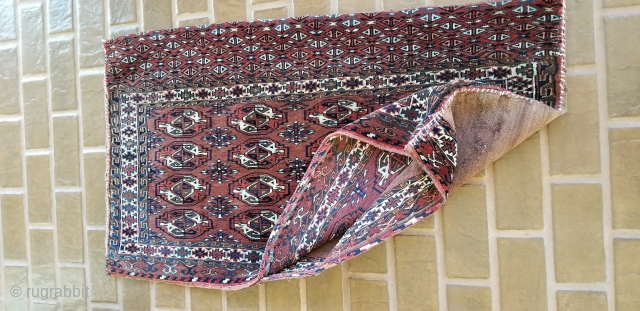 Turkmen Chuval.
Complete with back and remnants of ties.
Yomud??
Good pile on front and the piled band on the back.
Minor wear on red back.
47 inches long by 27 inches wide.
     