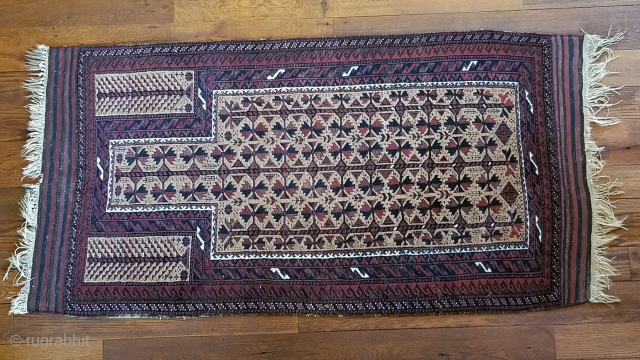 Baluchi prayer rug.
Stylized trees in hand panels.
Camel hair field.
Retains striped kelim aprons.
Minor oxidation loss of black colour.
39” wide by 77” long.
            