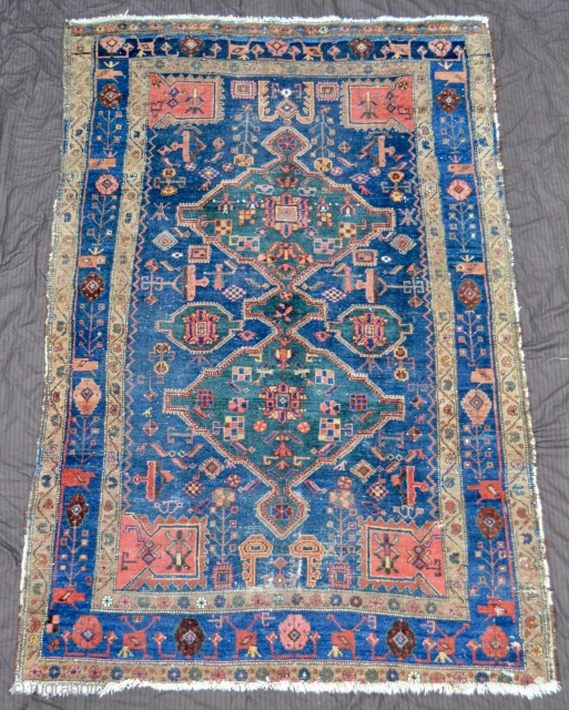 Kurdish antique rug, possibly Sanjabi. A few low areas, but still a beauty.

204x135cm/6'8''x4'5''                    