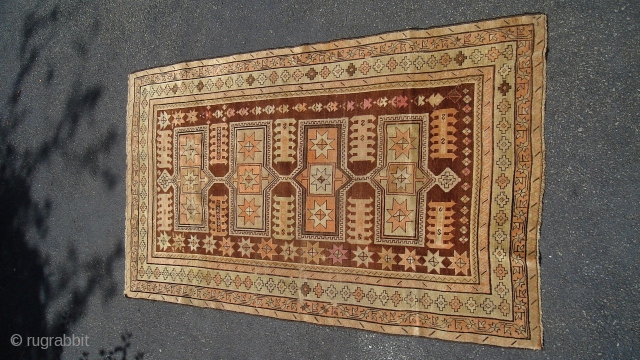 Caucasian Kazak (exact provenance unknown to me, opinions invited). Earlier 20th century, 6' 4" X 3' 6", uncommon earth tone colors and pleasing design. No significant oxidization, scattered small holes, otherwise even  ...