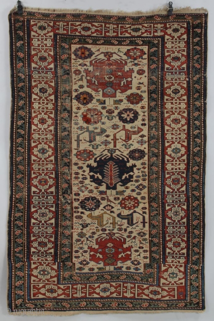 Unique design elements in this Caucasian piece (Shirvan?). 6' 0" x 4' 1" Overall good condition with some re-piling done, scattered minor, mostly oxidized wear; still very serviceable rug with lots of  ...