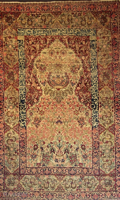 Kermanshah prayer rug from the 4th quarter of the 19th century with
cartouche and inscribed boders. Wide variety of natural colors and
refined execution of vase design. (i.e. Dimensions 4'8" X 7'0")   