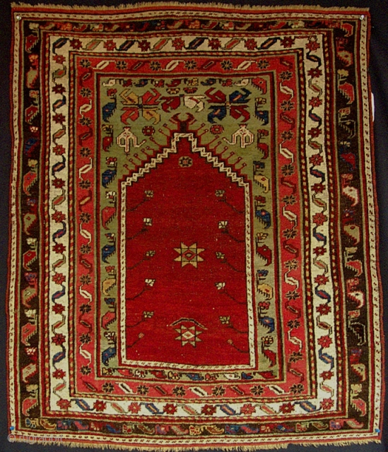 Small central Anatolian prayer rug from the turn of the century.
(i.e. Dimensions 3'2" X 3'9" )                 