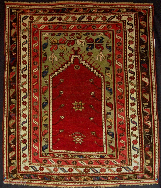 Small central Anatolian prayer rug from the turn of the century.
(i.e. Dimensions 3'2" X 3'9" )                 