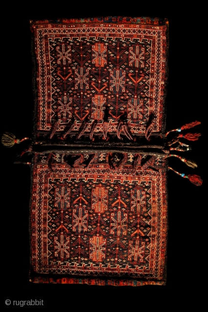 Bakhtiari saddle bag, 60x112cm, end of 19th century, Iran
Beautiful hand knotted ends with high pile.
Sewn together on the sides with finely spunned goat hair yarns. And all the black colors also made  ...