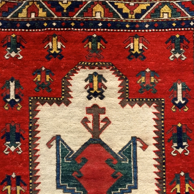 if you're looking for something really rare .... 'Frog-Kazak' prayer rug... i know only 7 published examples .... Please ask for more pictures and information! More beauties on sale: http://rugrabbit.com/profile/5160
   