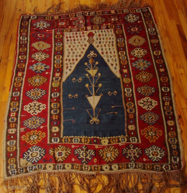 Erzerum Prayer Kilim

Provenance:  Northeastern Anatolia

Dimensions:  4'10" x 5'7" (151 cm x 174 cm)

Dated (woven into top of mihrab panel) 1292AH (1875)see detail photo

Excellent condition

       