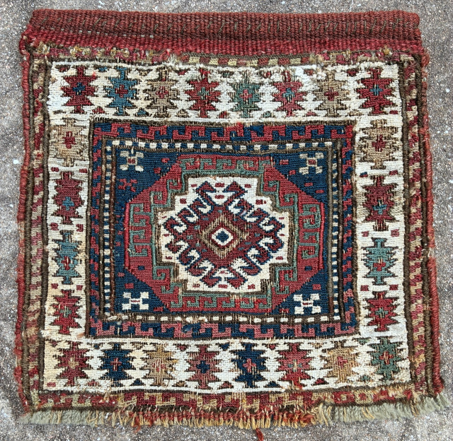 Shahsavan sumak khorjin face, 29 x 29 cm. White is cotton; evidence of repairs in bottom corners and a few other spots. Email: peparethos@xsmail.com         